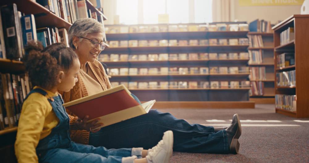 grandma-granddaughter-library